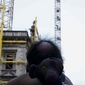 [Fotoreportage] Mensen zonder papieren op hijskranen boven Brussel